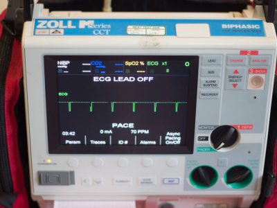 Zoll CCT Defibrillator equipment in red carrying case for cardiac arrest, ECG, AED